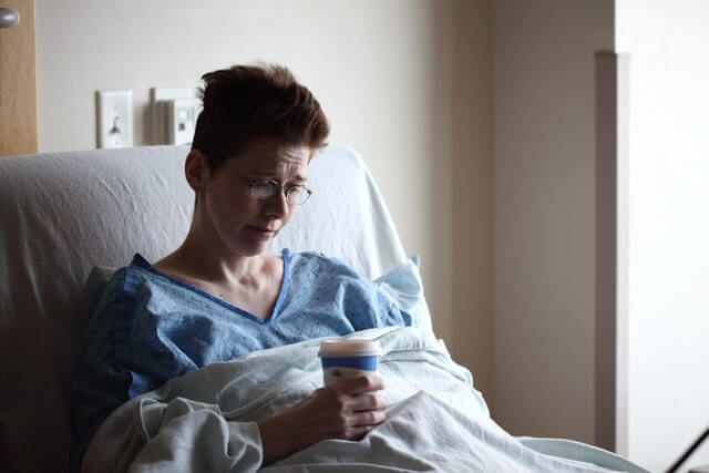 A sick woman in hospital that don't pose a problem for company projects, such as mobile app development, social media marketing, and search engine optimization for websites.